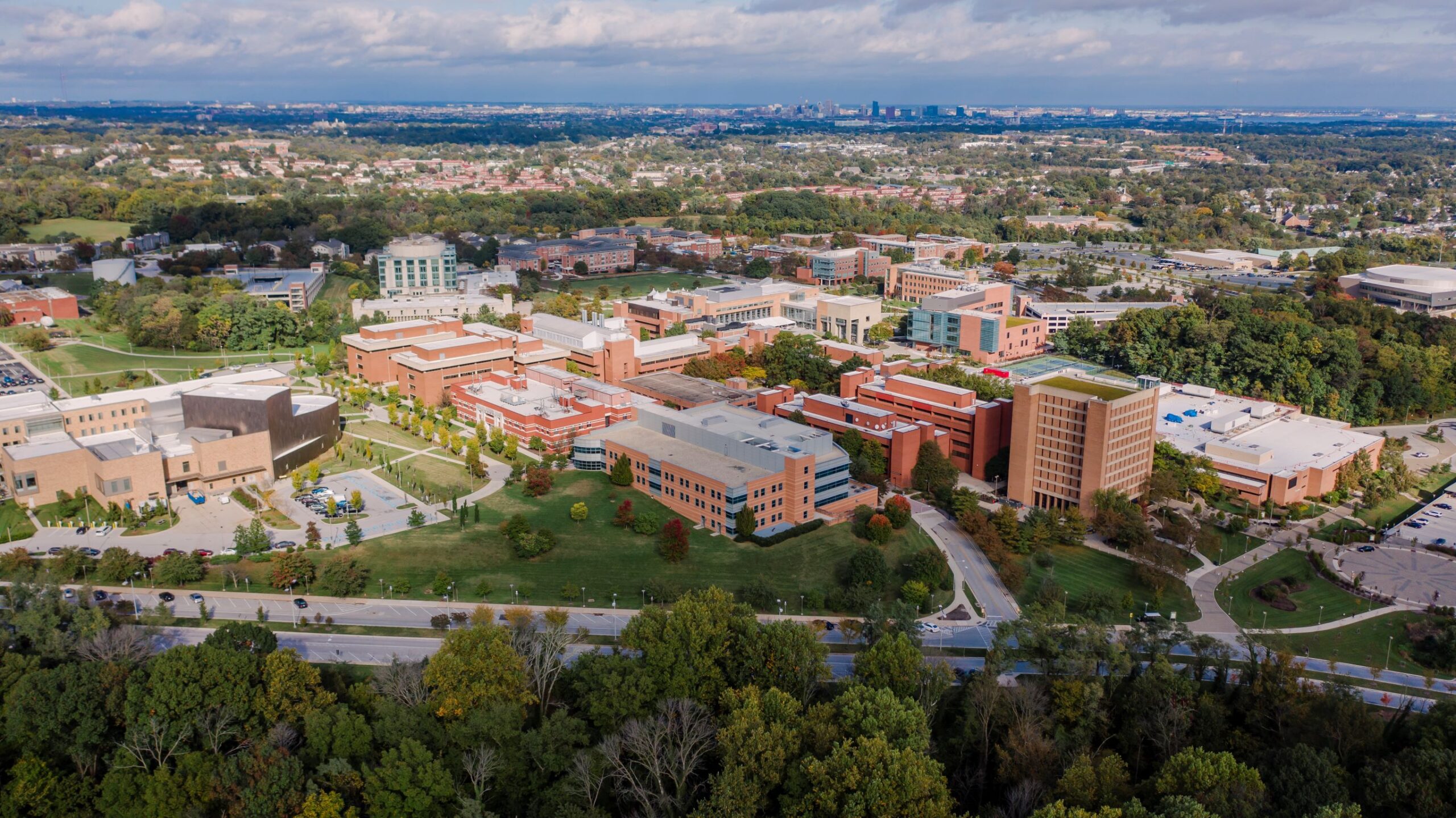 Aerial view of a university campus, with many buildings and trees