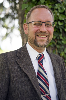 outdoor portrait of man wearing suit 