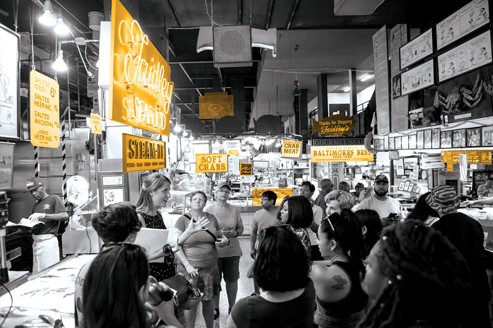 A UMBC walking tour inside of Lexington Market in Baltimore