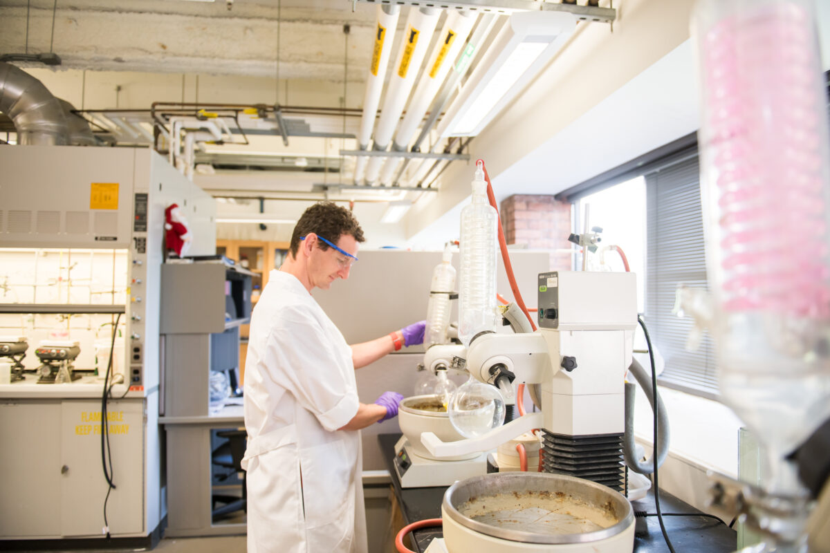 a student works at a lab bench 