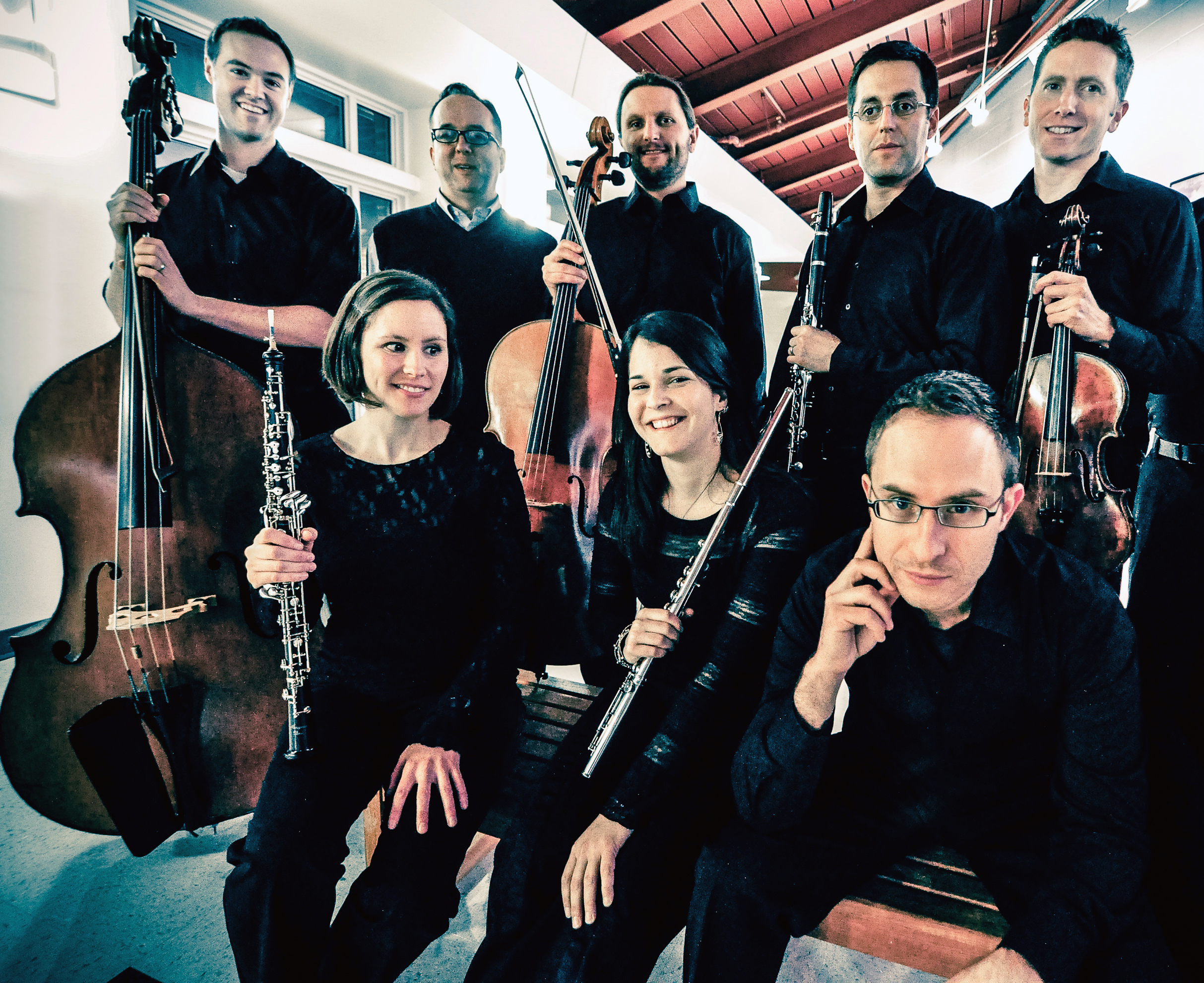 A group of musicians pose with instruments