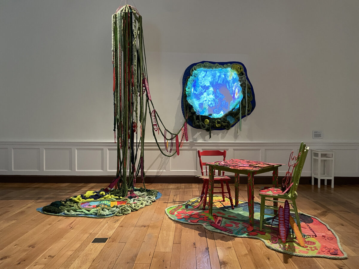 Colorful sculpture with table and chairs and other related pieces