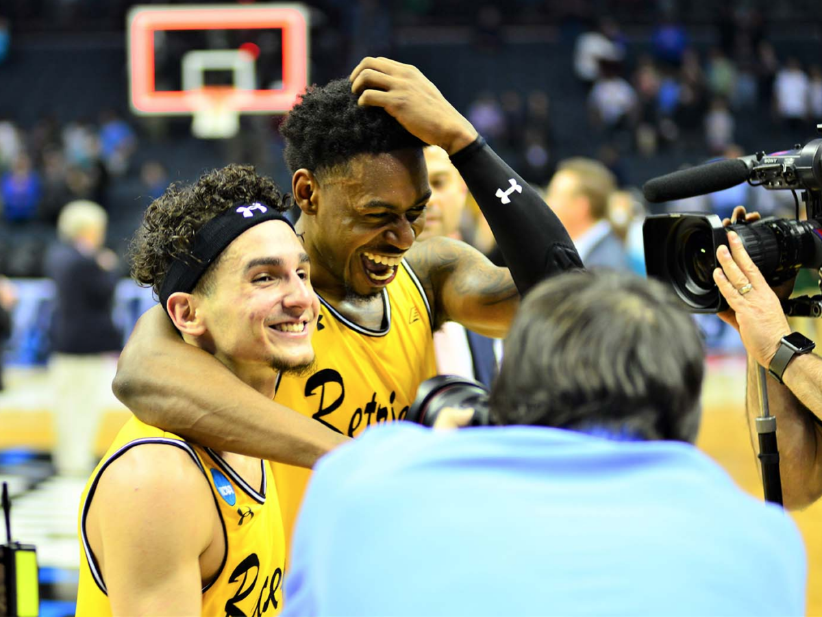 student basketball players celebrating their win