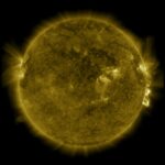 Dark yellow ball (the sun) with brighter yellow projections rising from the surface