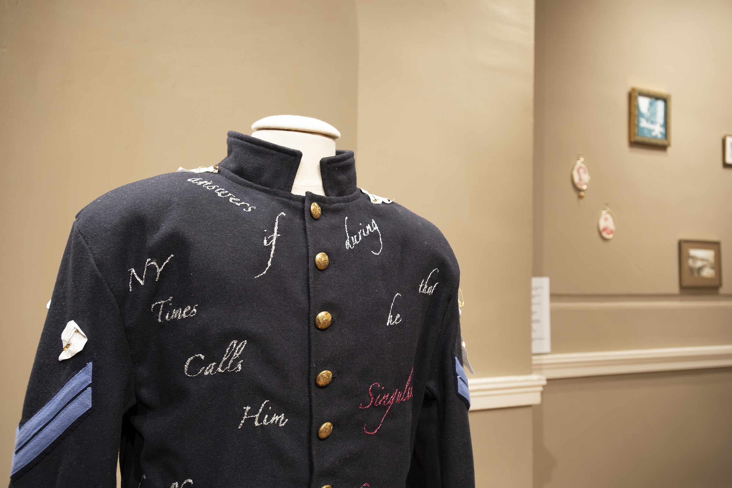 A Civil-War-era jacket (blue) covered with embroidered words