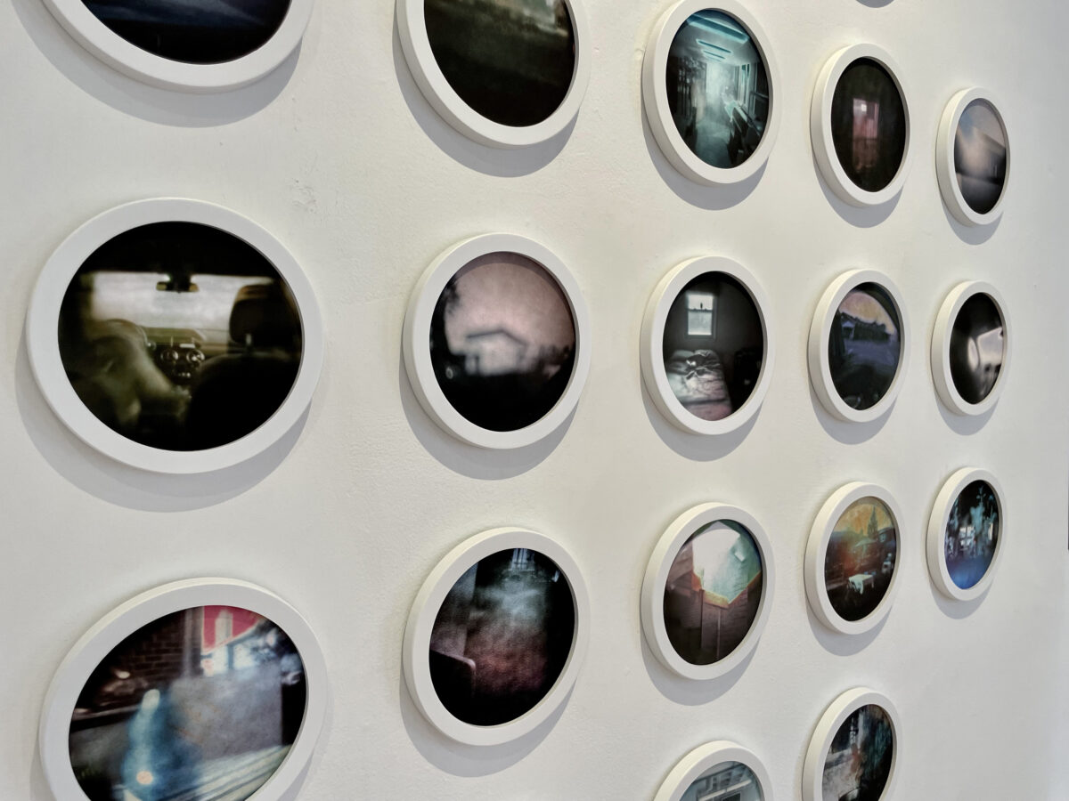 a collection of circular images on a wall for Spark show