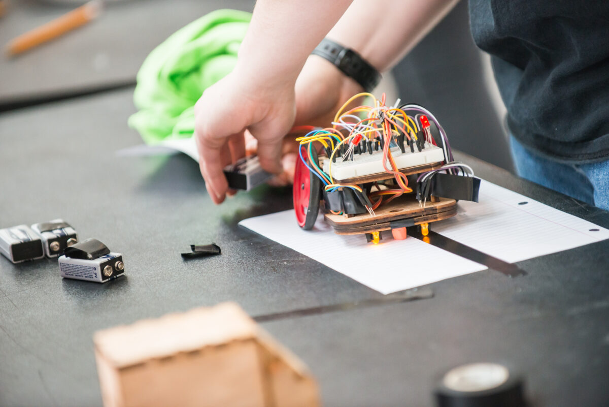 A student's hands working on an engineering project. Photo used for U.S. News story