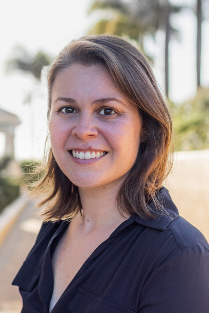 Portrait of smiling woman with shoulder-length brown hair and collared shirt (Science and Technology Policy Fellow Erika Fountain)