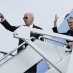 President Joe Biden and first lady Jill Biden wave before boarding Air Force One