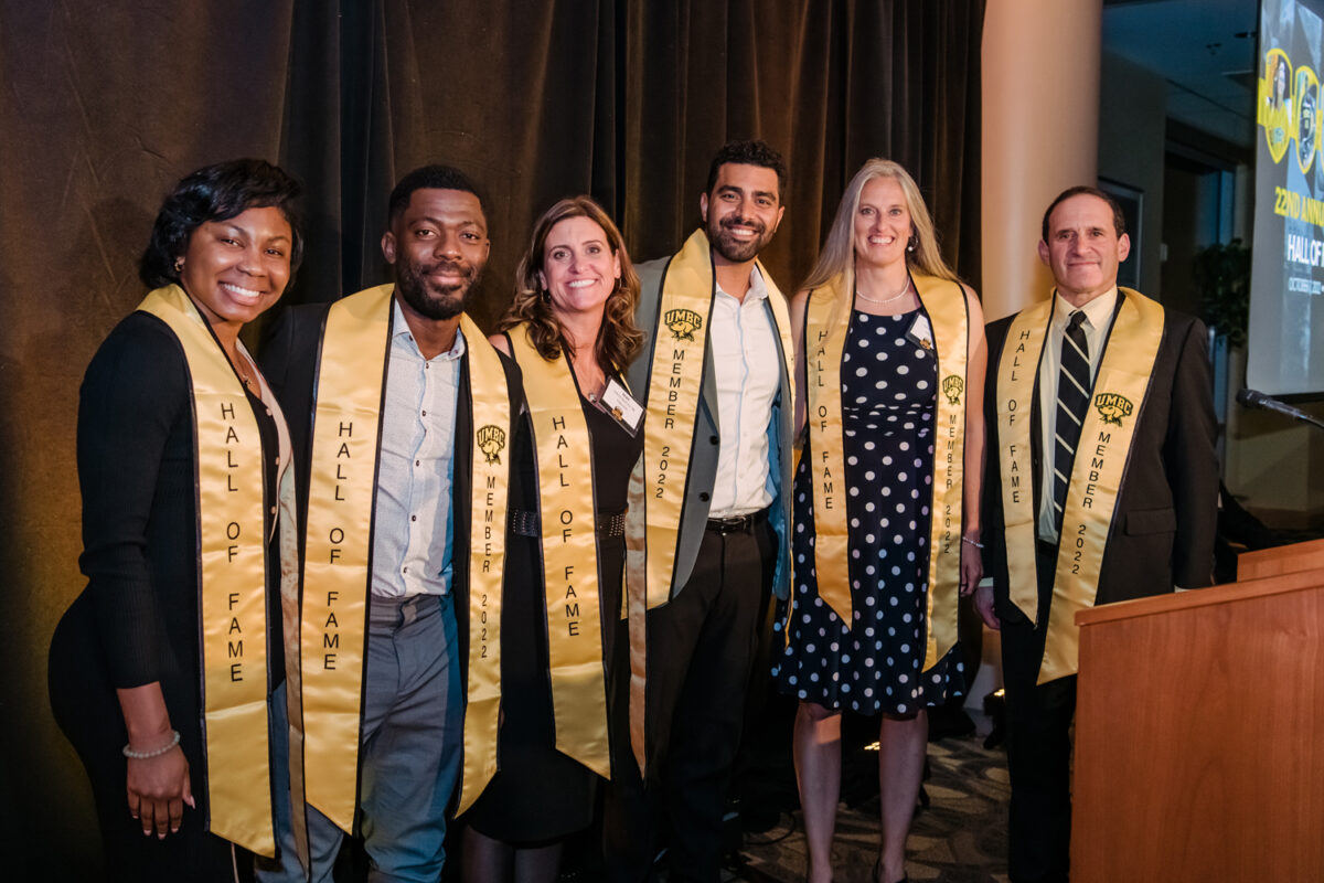 New 2022 Hall of Fame members pose together in gold stoles