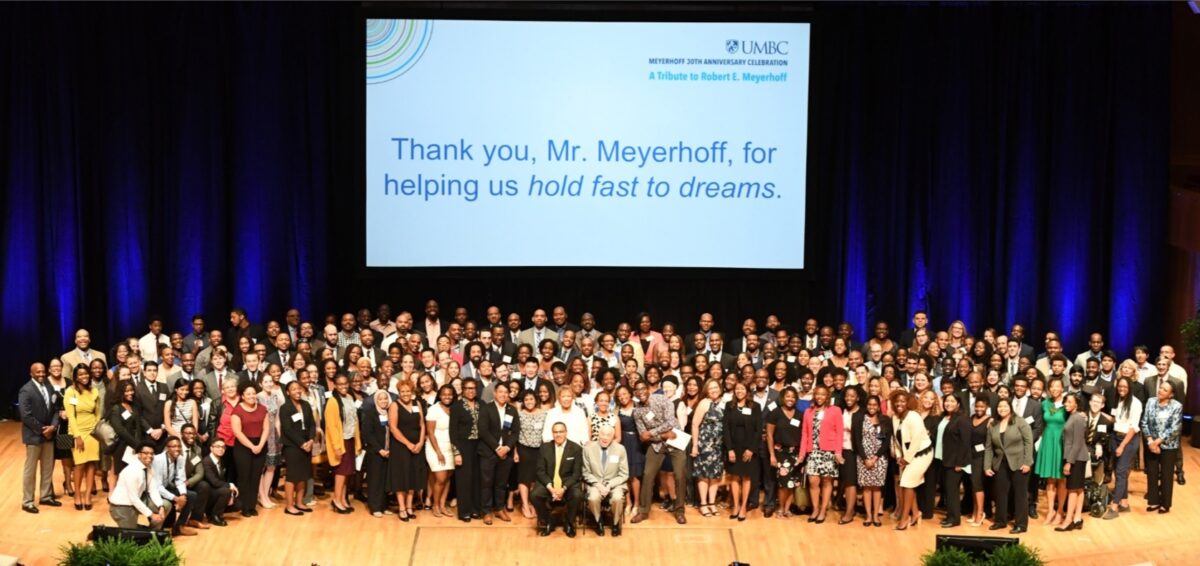 Meyerhoff Scholars gather on the stage for the program's 30th anniversary.