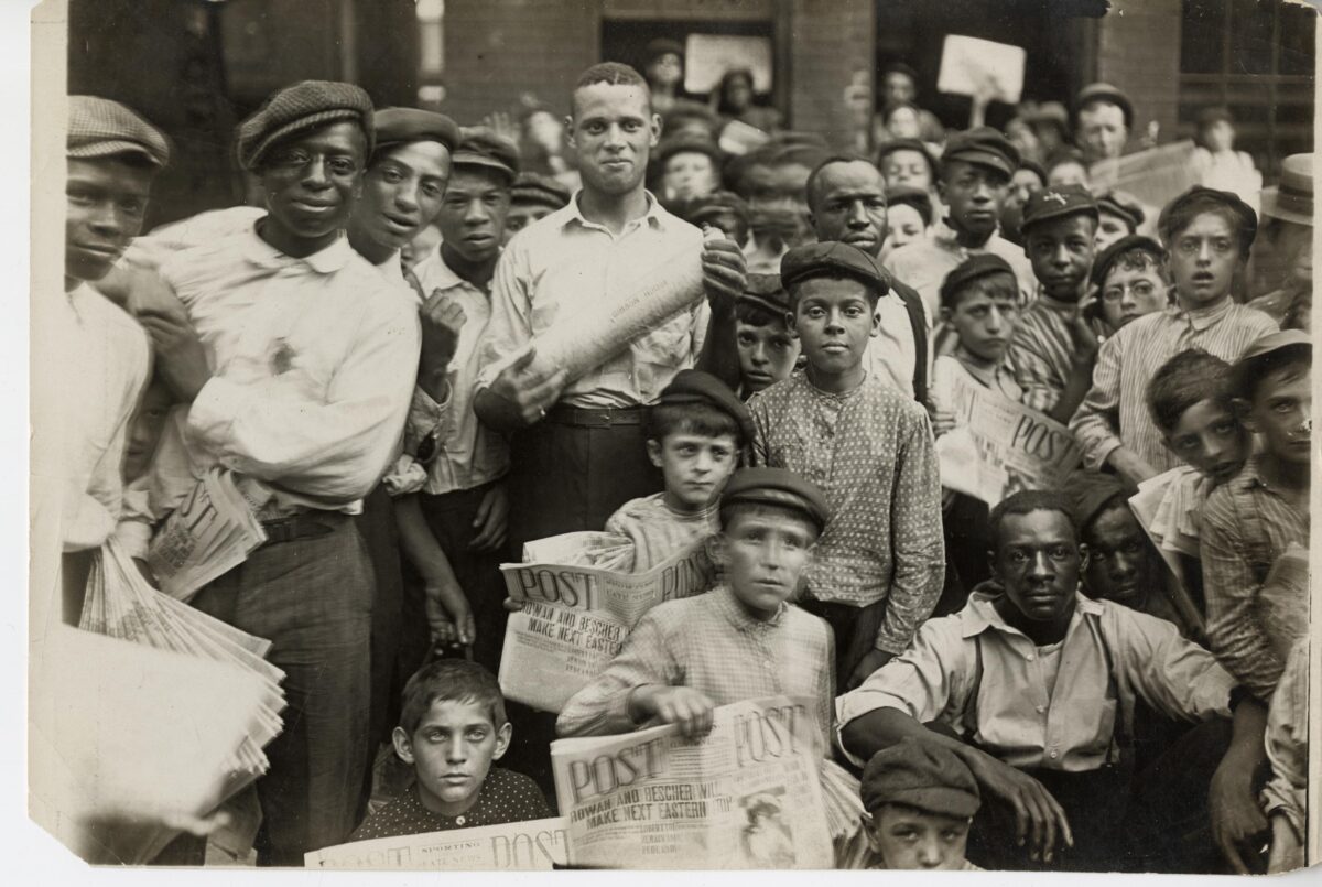 Newsboys and supply men in a 1908 Lewis Hine photo.
