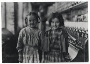 Two young girls working in a factory. Lewis Hine collection.