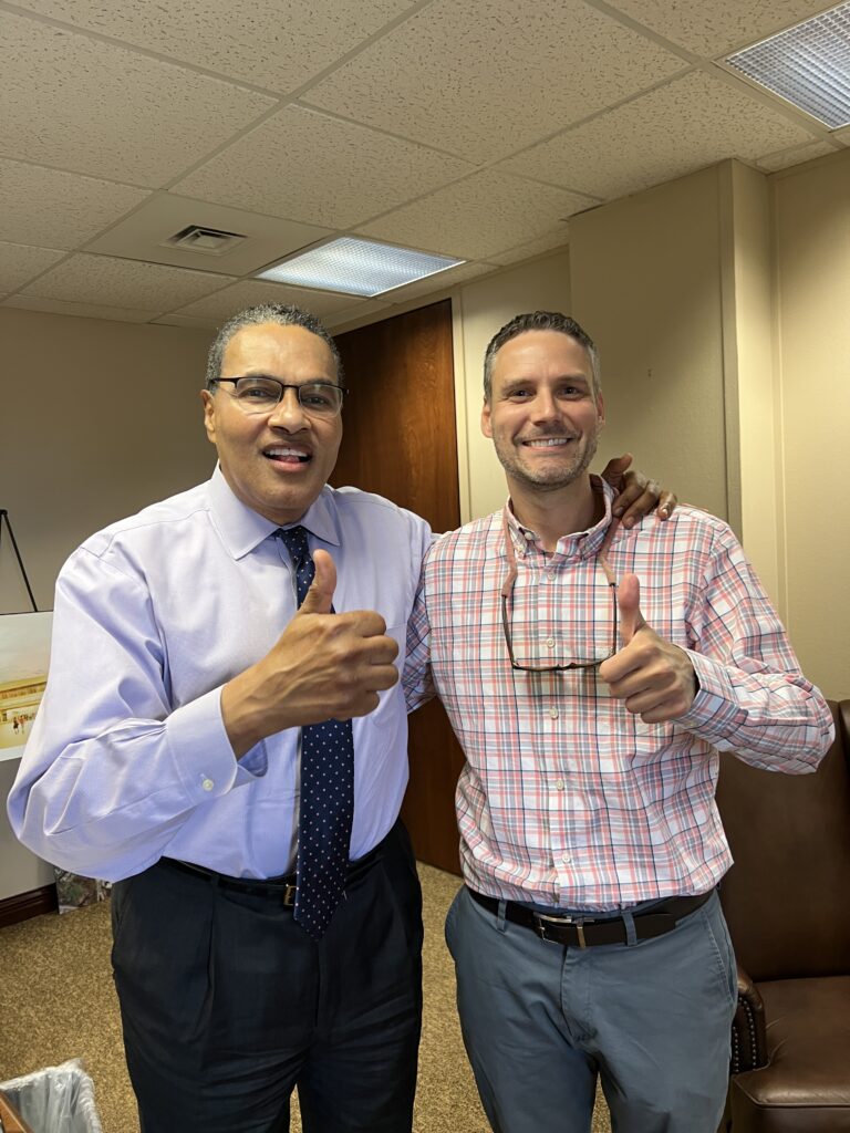 Two men celebrate being UMBC retrievers