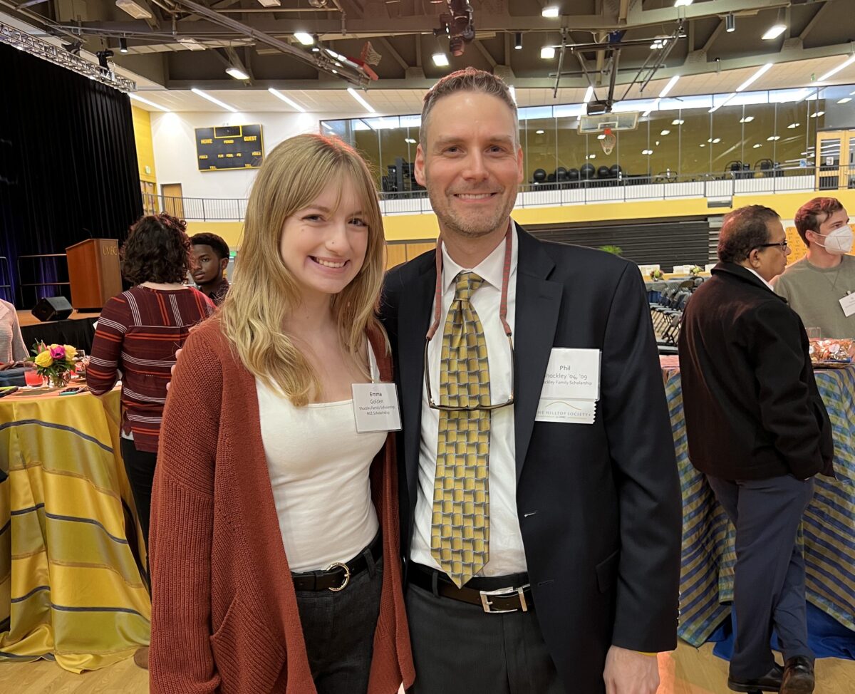 A woman and a man celebrate Retriever scholarships at UMBC