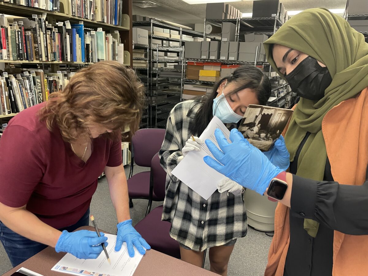 Students use original Lewis Hine photos for research.