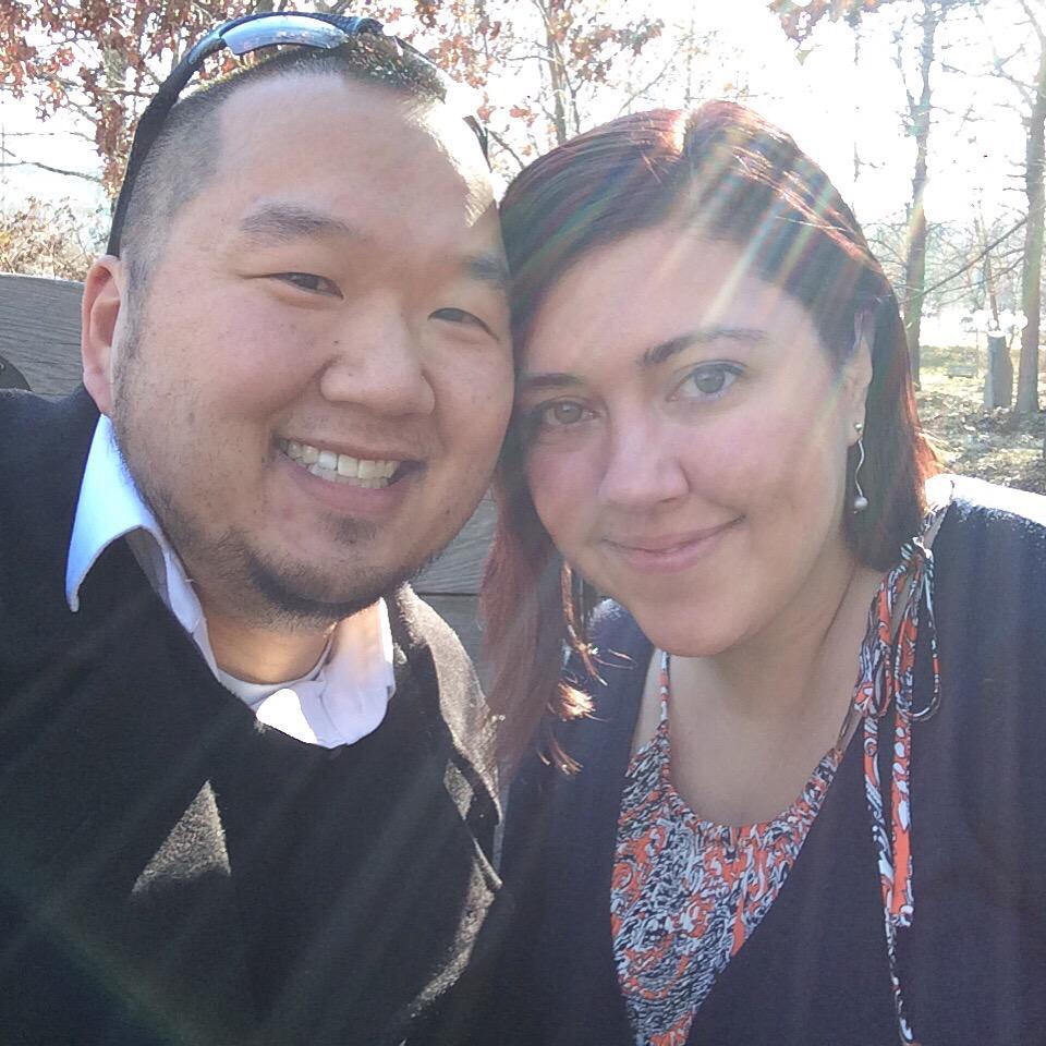 a couple takes a selfie on a sunny day at UMBC's rock garden at the knoll. The Dissmeyers are recurring donors at UMBC.