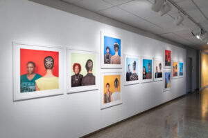 Sonya Clark's Hair/Craft exhibit at the AOK Library Gallery. Images of the front and back's of Black hair styles.