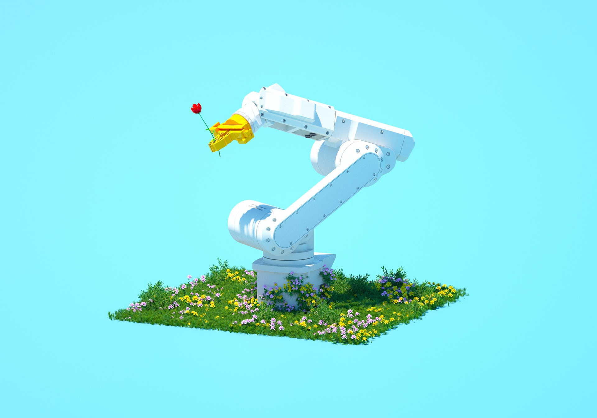 A large white robot arm sits in a field of flowers and holds a red flower in its hand.