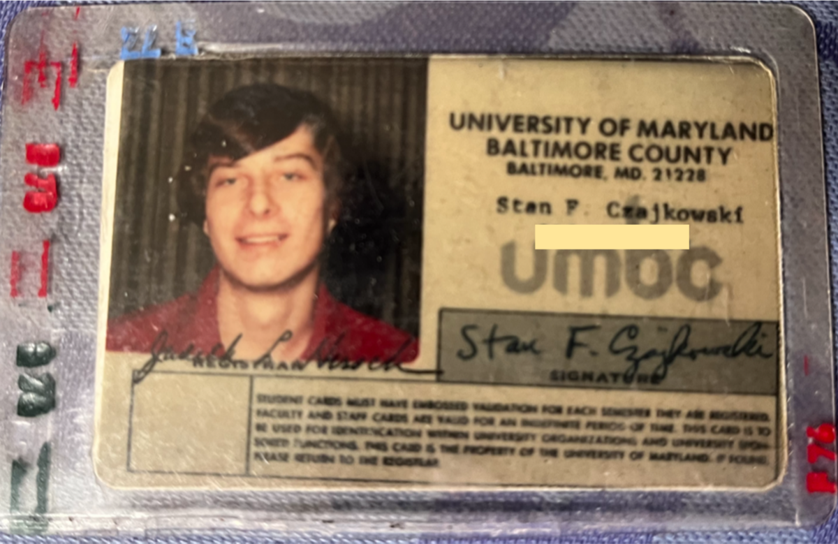 student ID card of a young man from the 70s wearing a red shirt