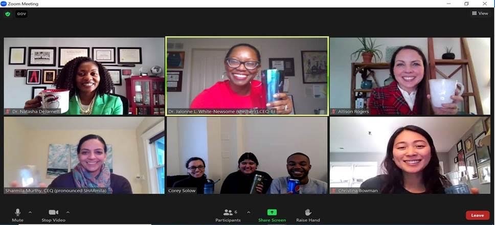 A screen shot of eight people in a Zoom meeting.