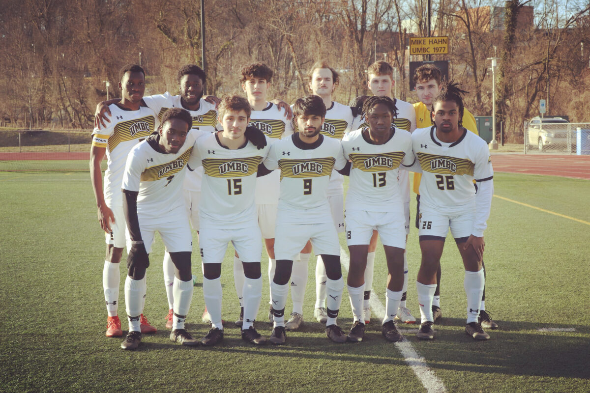 UMBC's club soccer team posing on the soccer field. 