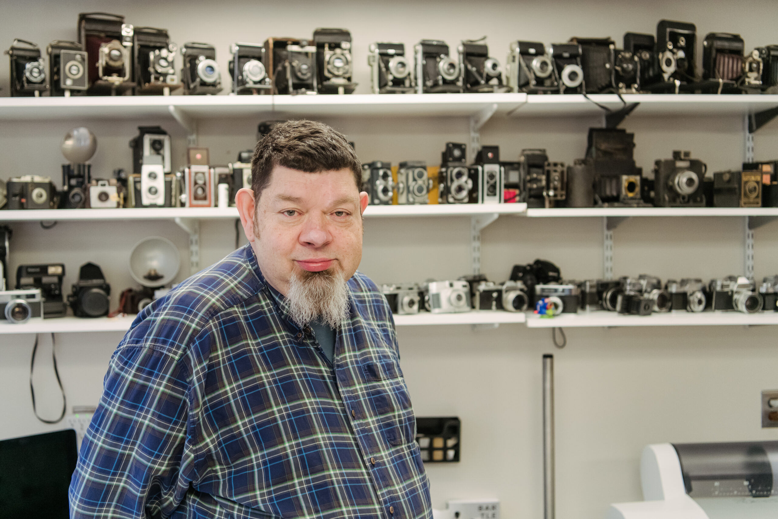 Peregoy displays a collection of vintage cameras.