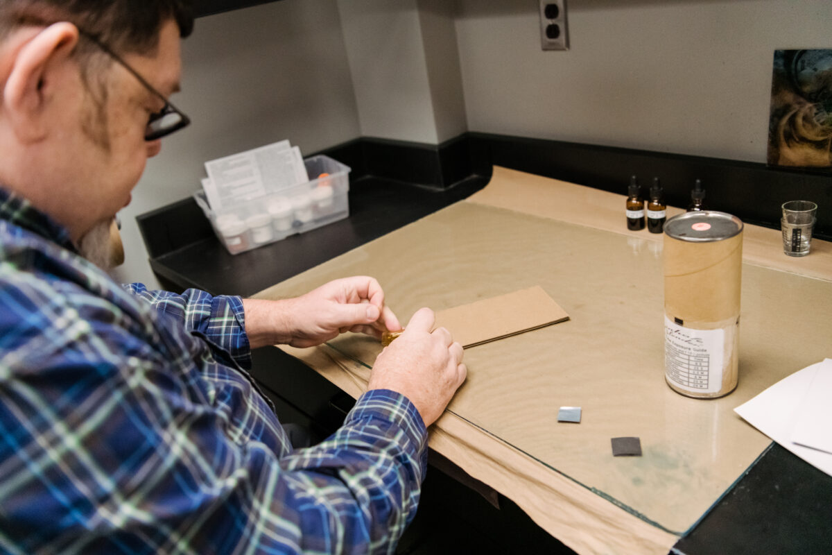 Peregoy builds a pinhole camera using cardboard.
