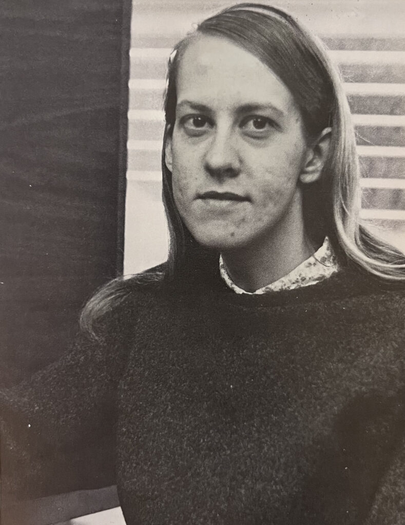 black and white photograph of a young woman in a sweater