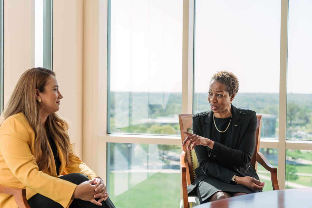 UMBC President Valerie Sheares-Ashby, speaking with a colleague during office hours.