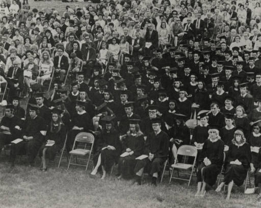 Students gather during a commencement ceremony.