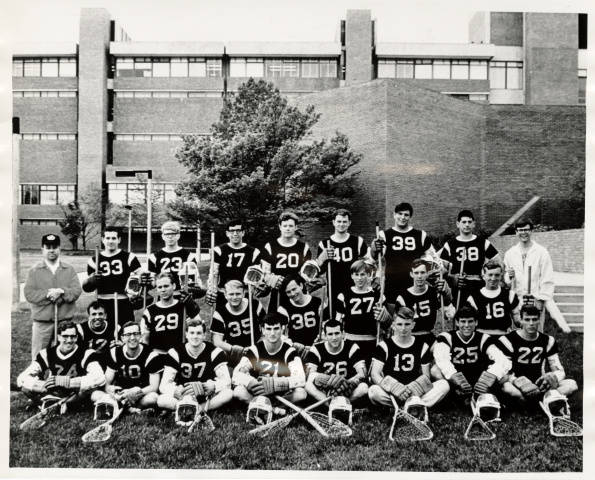 A men's lacrosse team poses for a photo.