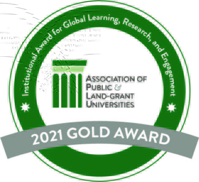 2021 Gold Award Icon, it reads Association of Public and Land-Grant Universities, with a ring around it that says Institutional Award for Global Learning, Research, and Engagement.