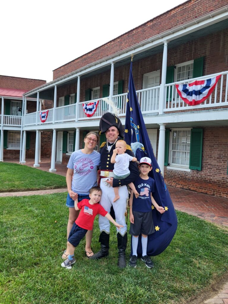 Jim bailey poses with his family at Fort McHenry in Baltimore City.