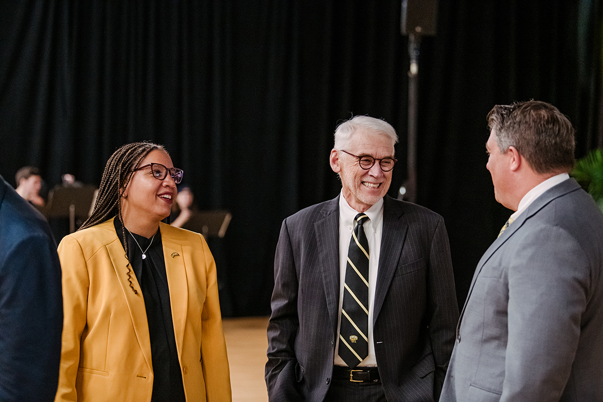 Members of UMBC's leadership team, speaking together at the 2023 Fall Meeting.