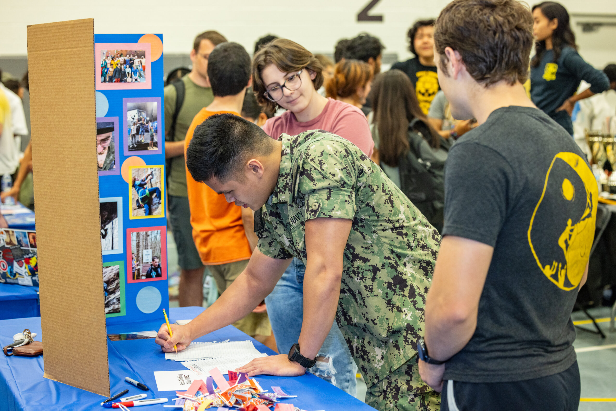 Students look at a presentation by student organizations or club at Involvement Fest.