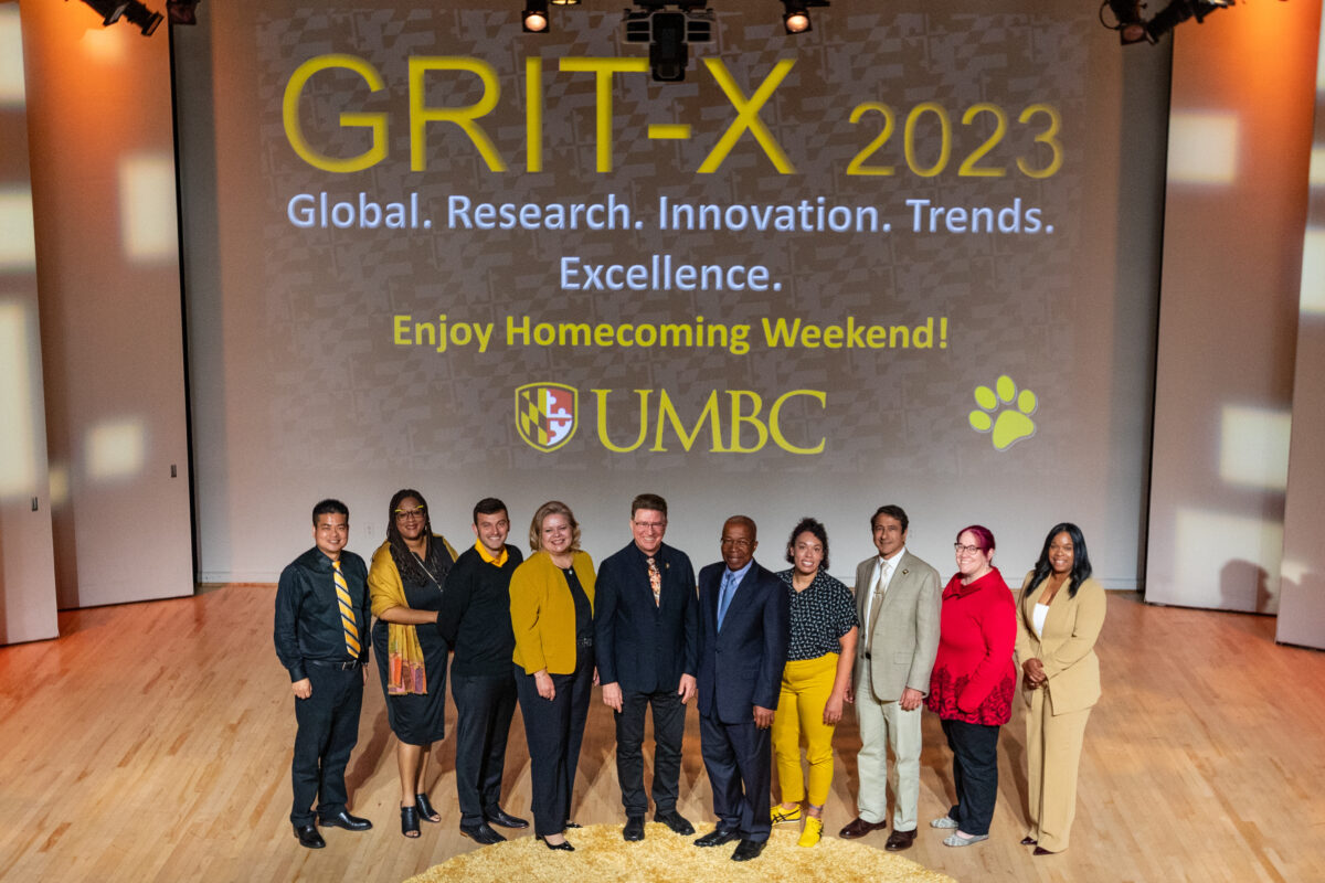 GRIT-X 2023 presenters standing on stage