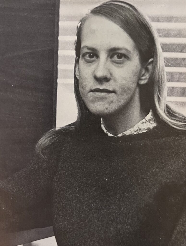 Black and white photo of a woman with straight hair