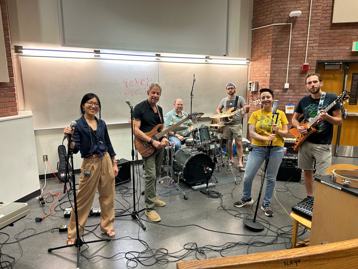 Fever Dream, the band of biology department members, practices in a lecture hall