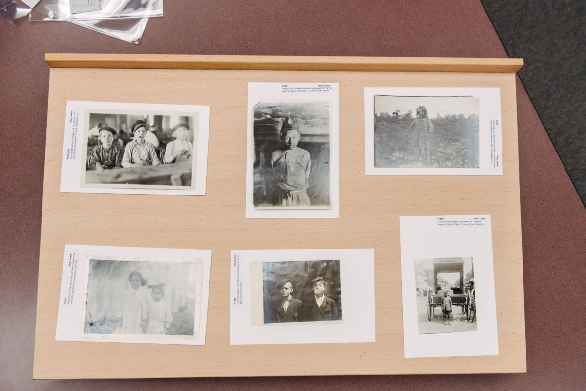a collection of six historical photos laid out on the table together