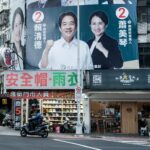 Large billboards with images of a man and a woman promoting the Taiwanese election
