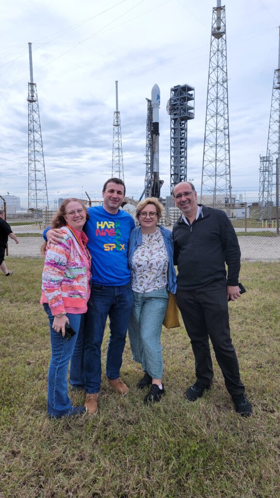 four people stand in front of a launch area