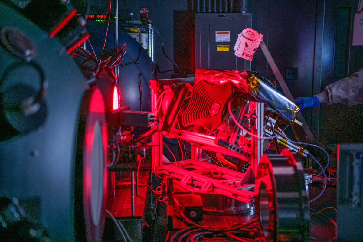 image of a technical instrument flooded in red light during a test