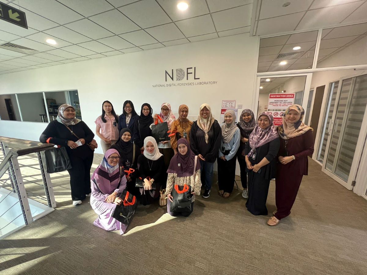 Group of women pose outside the National Digital Forensics Laboratory in Brunei