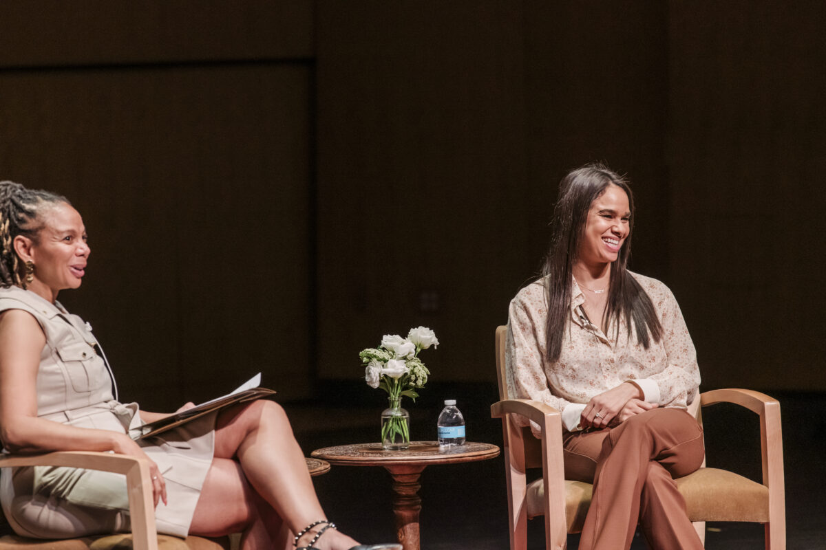 Misty Copeland and Dean Moffitt are in conversation in front of a crowd