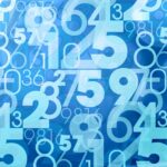 bright blue background with lots of numbers in the foreground in different sizes and shades of light blue
