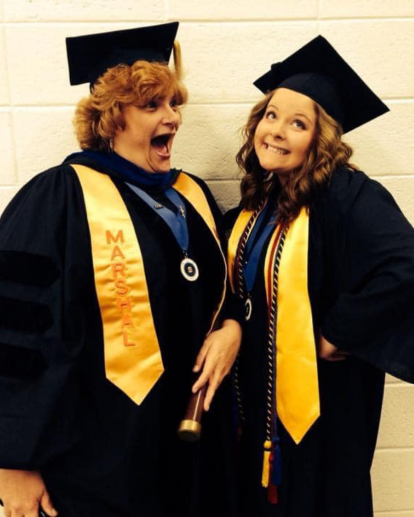 Connie Pierson goofing with her niece, Kelsey Krach '04, anthropology and spanish, a Sondheim Scholar and valedictorian finalist, at graduation where Connie served as the staff marshall