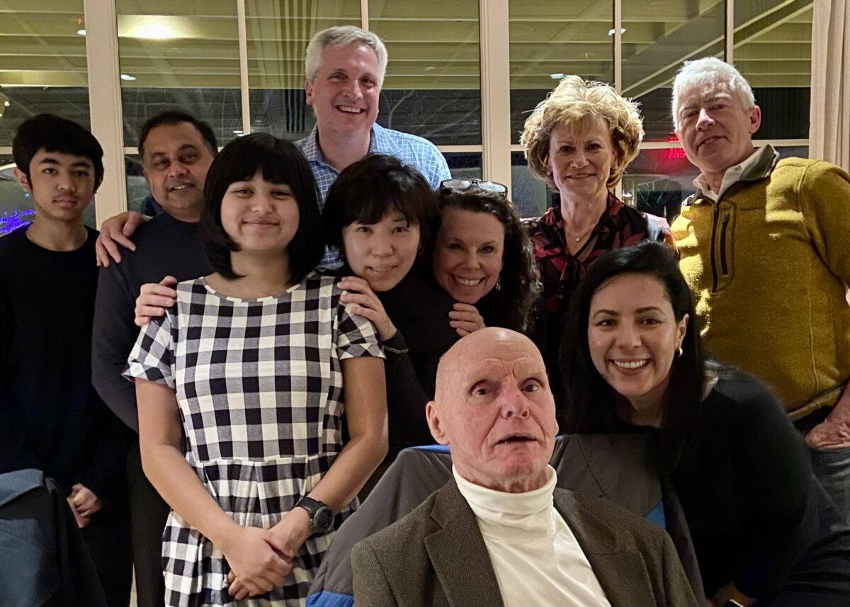 Chuck Peake on his 90th birthday surrounded by family, friends, and former students.