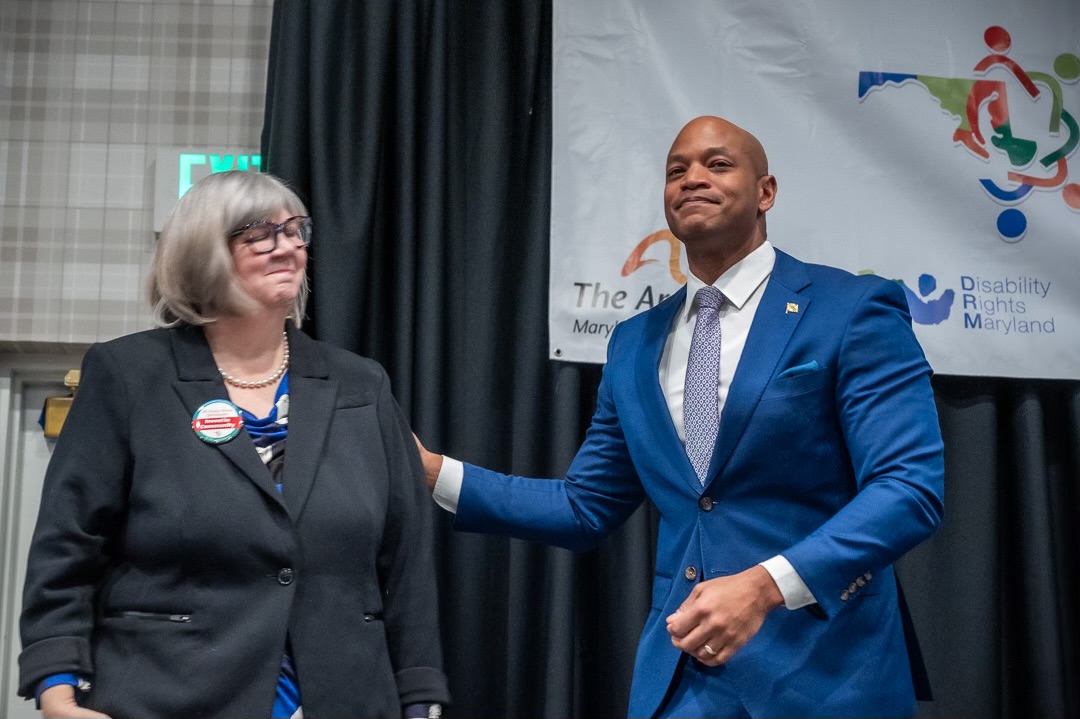 Laura on stage with Governor Wes Moore at Developmental Disabilities Day in Annapolis 2024, a huge advocacy event that she helped lead.
