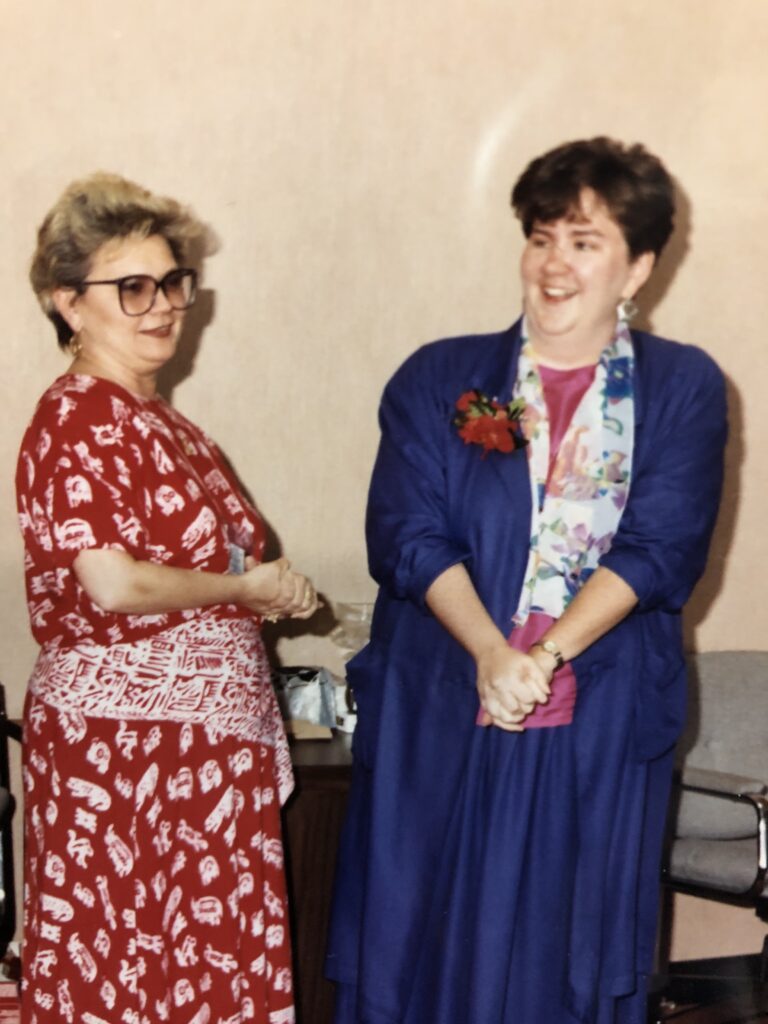Laura standing with her first mentor, Judy Orlinsky, after receiving an award for Best Employee for the State of Maryland, Professional and Administrator Category, for her work in the Maryland Homeless Services Program in the late 80s and early 90s. 